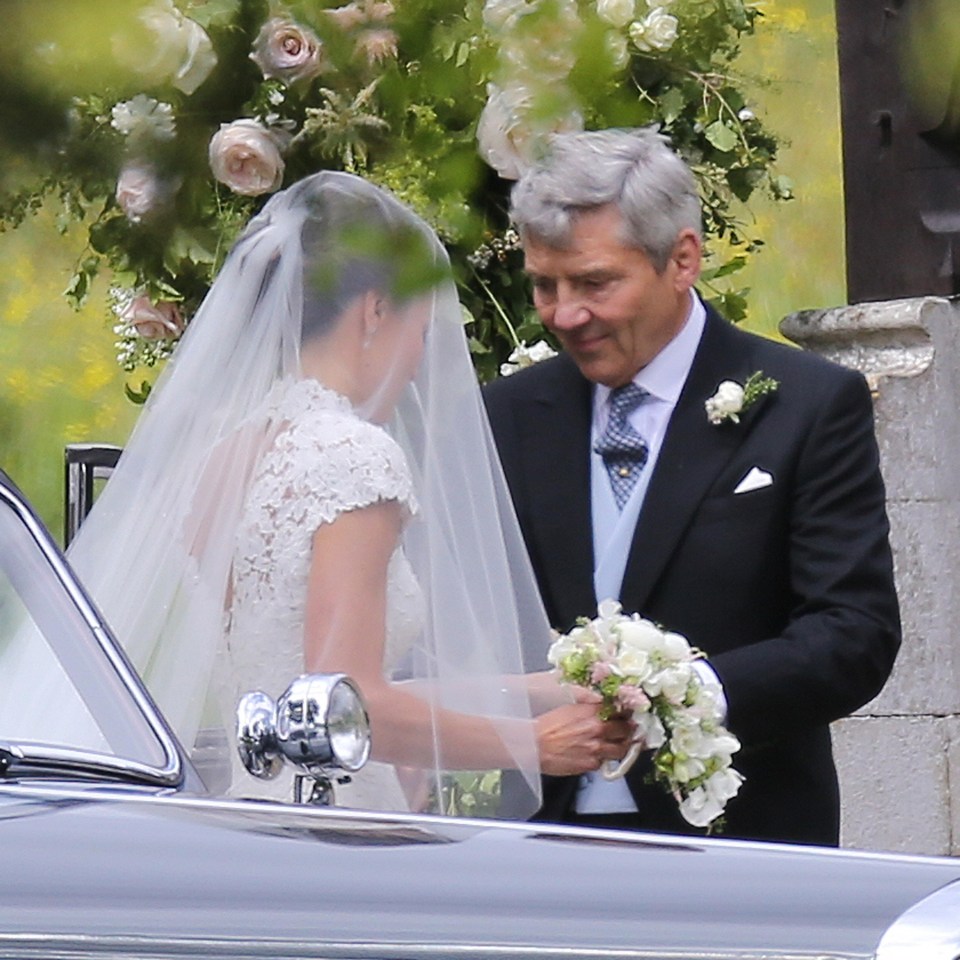 Pippa and her father Michael shared a tender moment together before making their way into the church