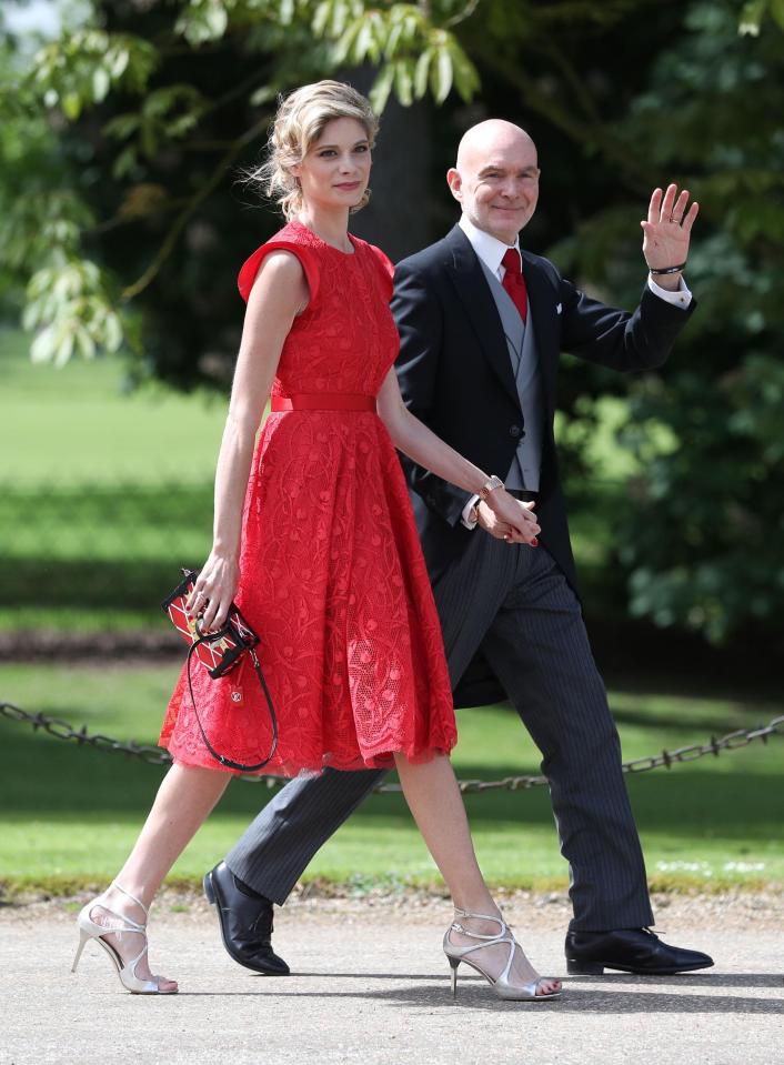  This wedding guest looks striking in red as she joined the congregation