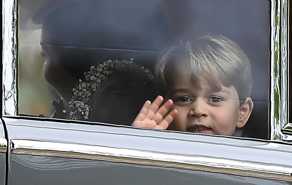  The young royal was then seen looking out the window as he sat next to sister Princess Charlotte