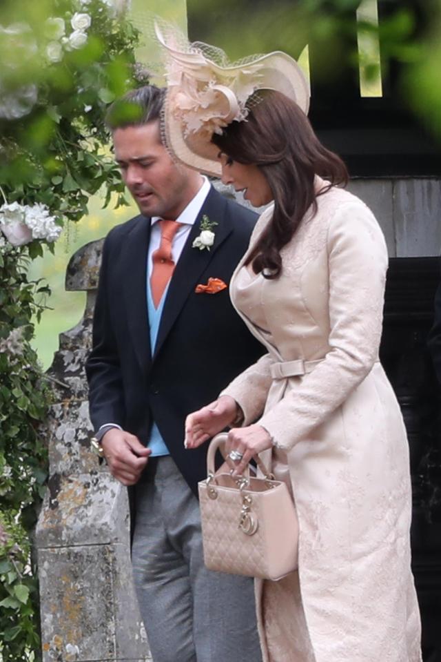  Reality TV star Spencer Matthews walks out of the church with a friend while girlfriend Vogue Williams was at home