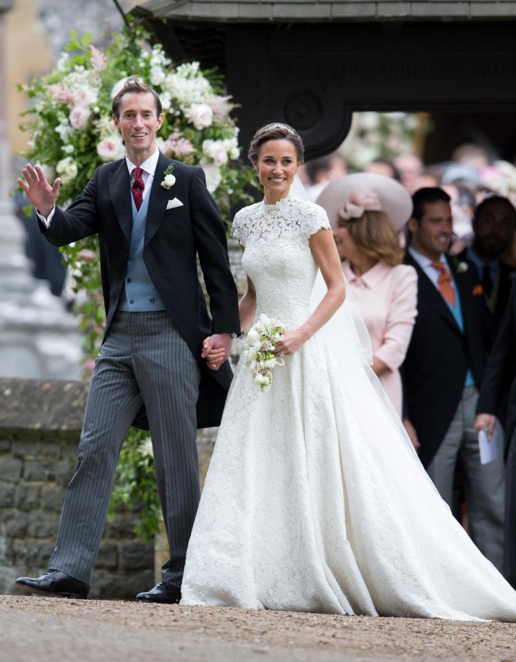  Smiling Pippa posed for photographers in her show-stopping, guipure lace gown gown