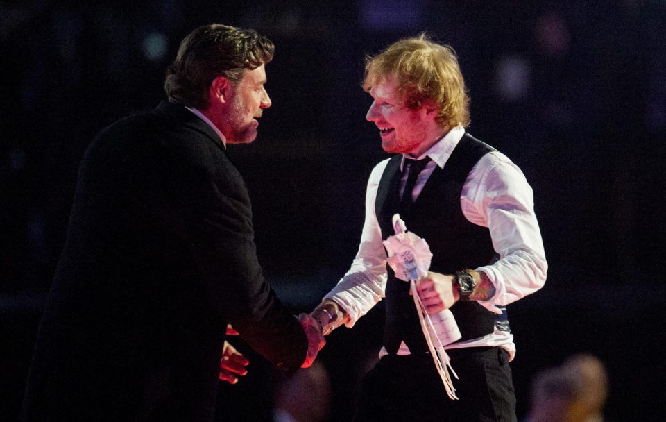  Russell Crowe presents Ed Sheeran with a Brit Award in 2015