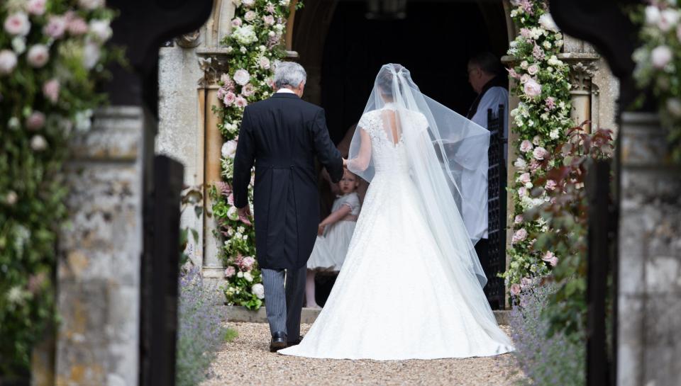  Giles' spectacular dress for Pippa Middleton featured cap sleeves and an elegant high neckline. She also wore a glittering tiara and Manolo Blahnik heels