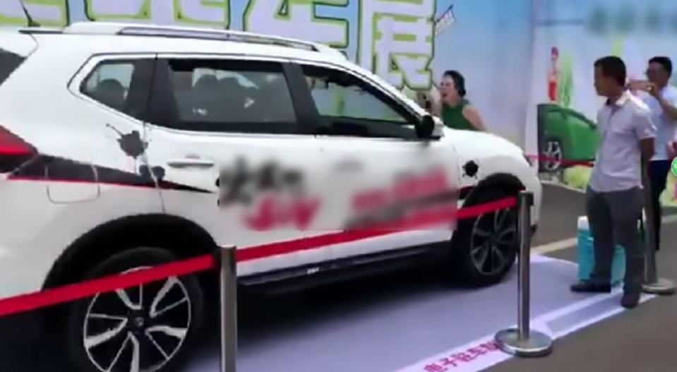 A hostess at a Chinese motor show was rundown by a driver demonstrating Nissan's new collision avoidance system