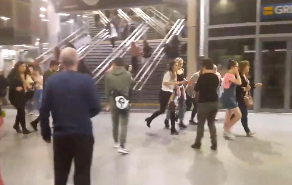  Terrified people running through Manchester Victoria station after an explosion at Manchester Arena