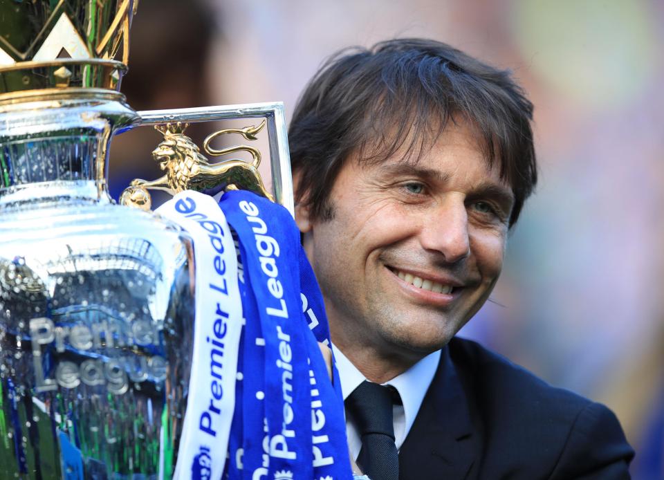  Antonio Conte hoists the Premier League trophy