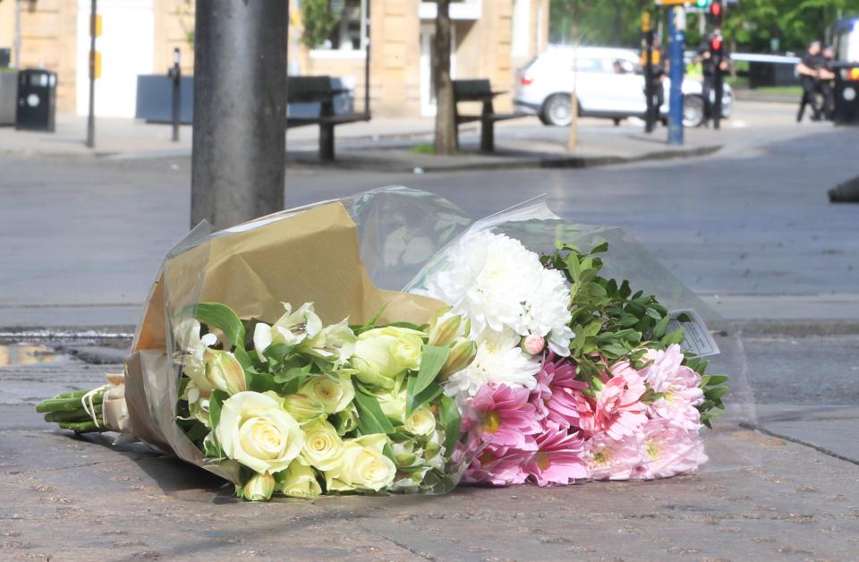  Flowers left close to the Manchester Arena, the morning after a suicide bomber killed 22 people