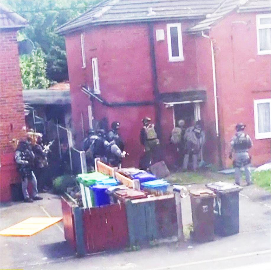  Armed cops surround Manchester-born Abedi's house – just four miles from the scene of the bombing