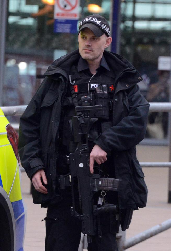  Armed police outside Manchester Piccadilly train station this morning as the Met confirmed increased police numbers and operations across London