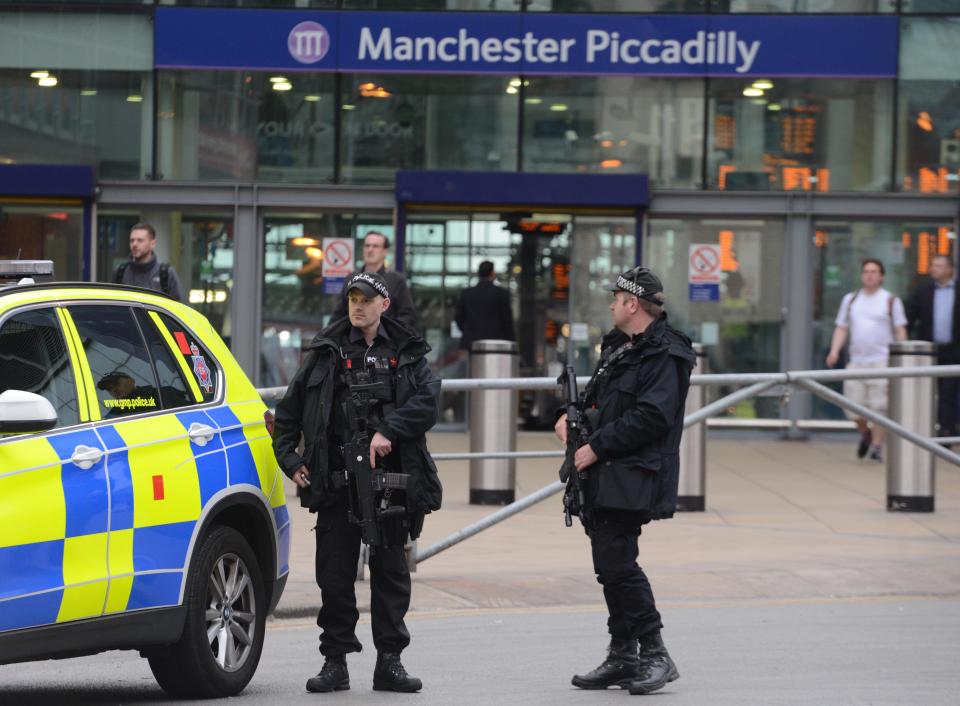  Armed police outside Manchester Piccadilly train station during rush hour this morning