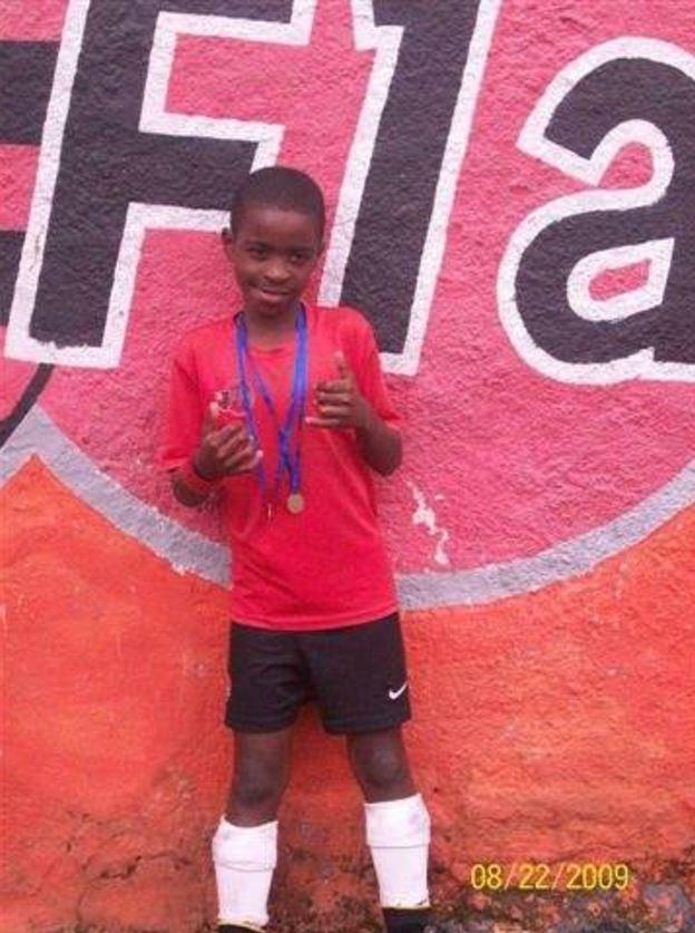  Vinicius Junior. posing with a medal as a young boy, grew up in poverty