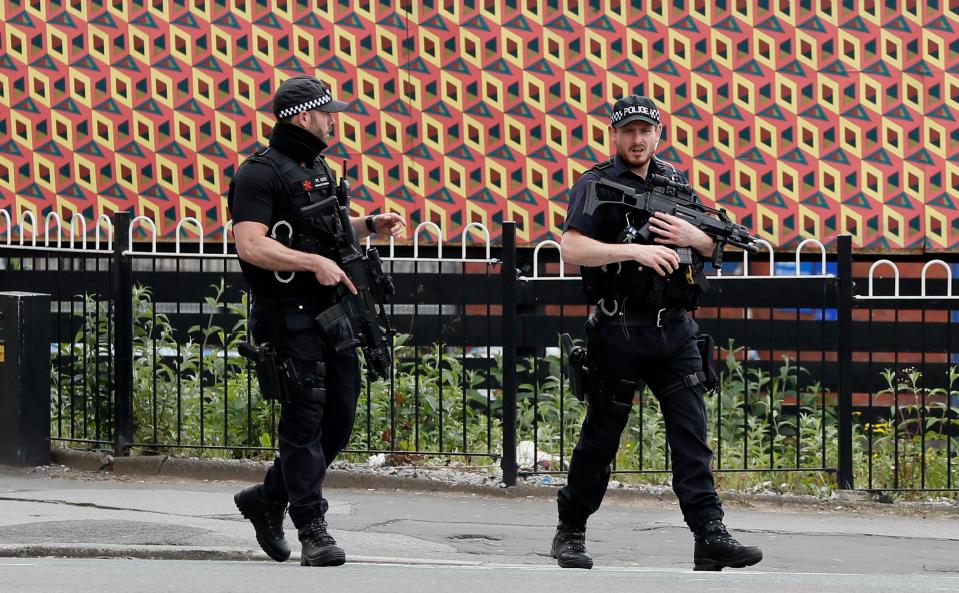  Armed police keep guard near Victoria Station in Manchester this morning