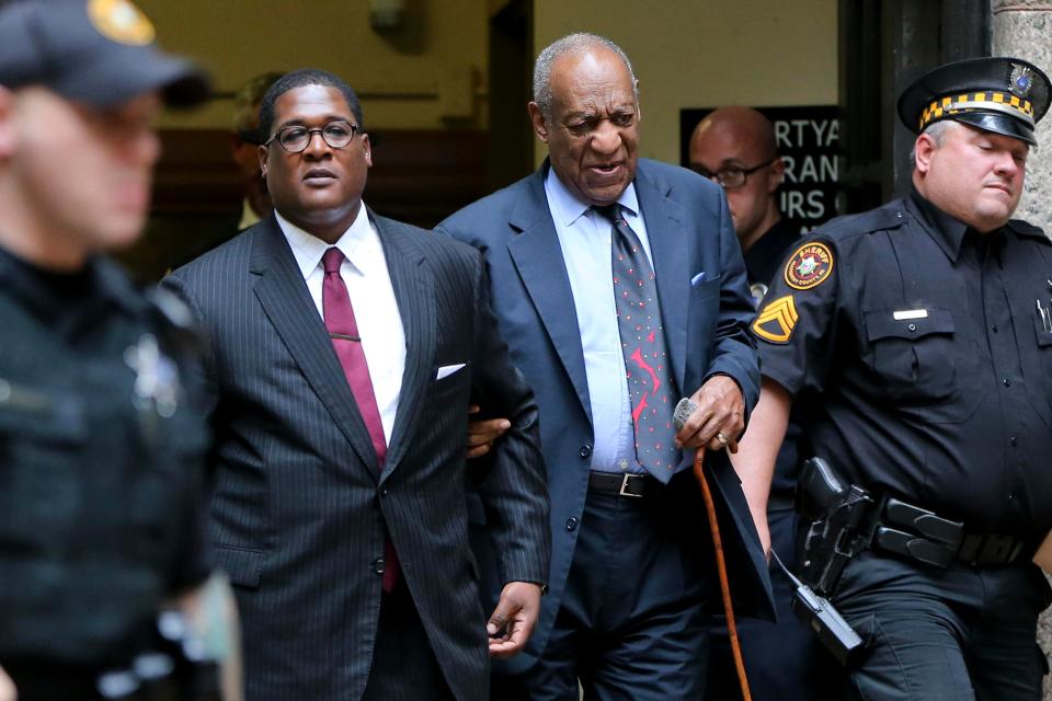  Bill Cosby, second right, leaves with his publicist Andrew Wyatt at the Allegheny County Courthouse after a third day of jury selection