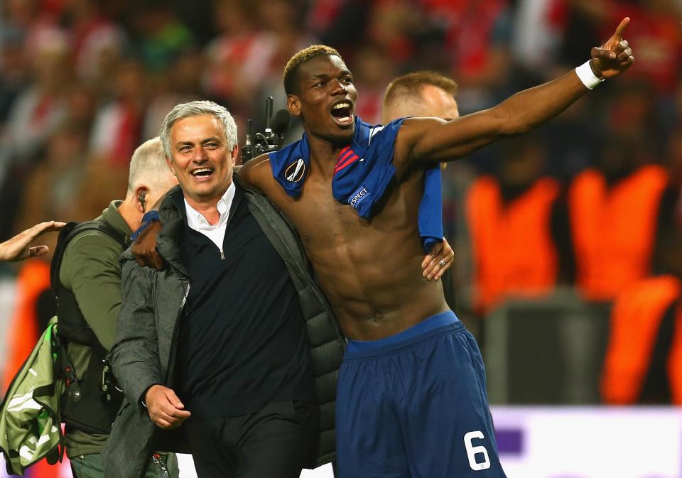  Paul Pogba celebrates with Reds boss Jose Mourinho after Europa win