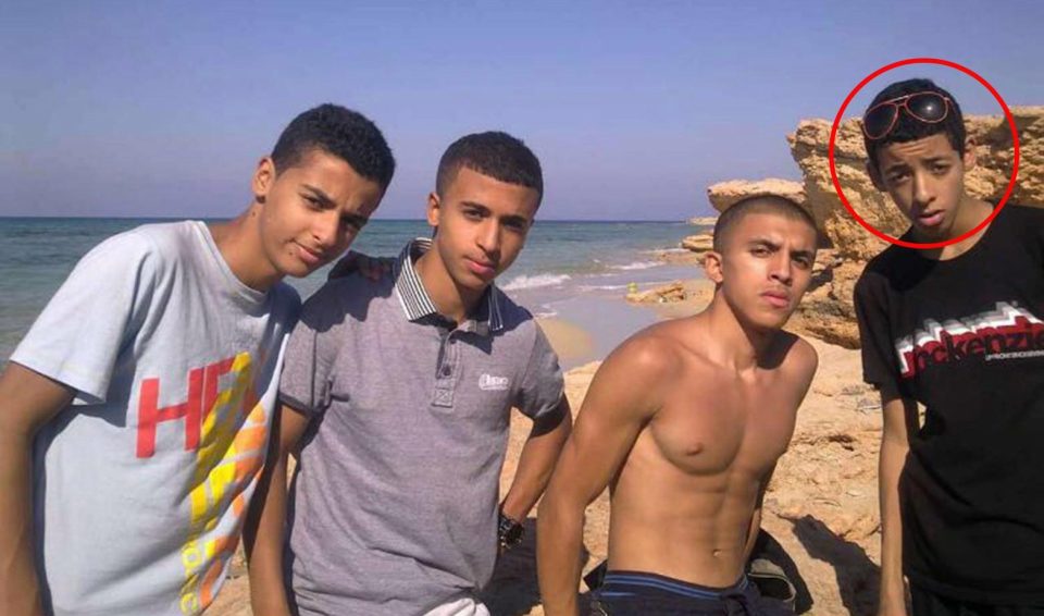  Abedi is pictured on the beach with pals during a trip to Libya as a kid