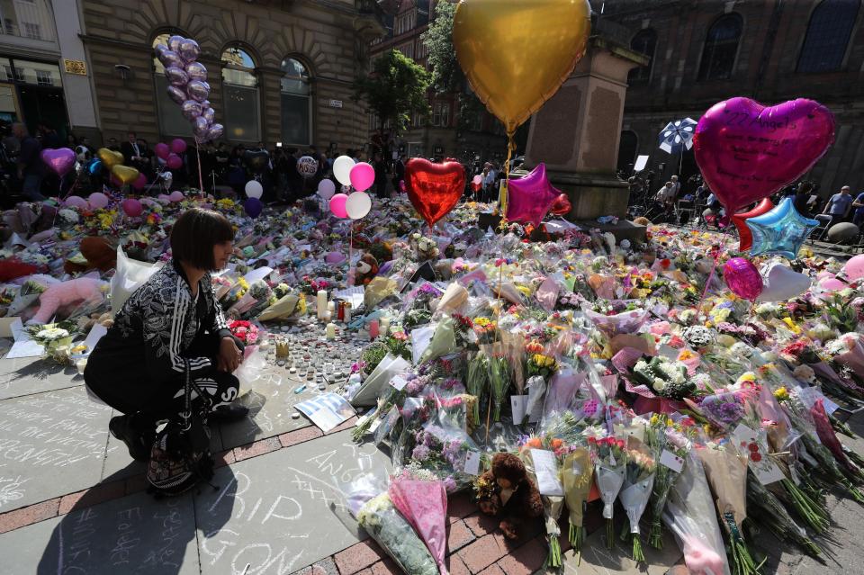  Floral tributes have been left in their hundreds in square near city's Town Hall