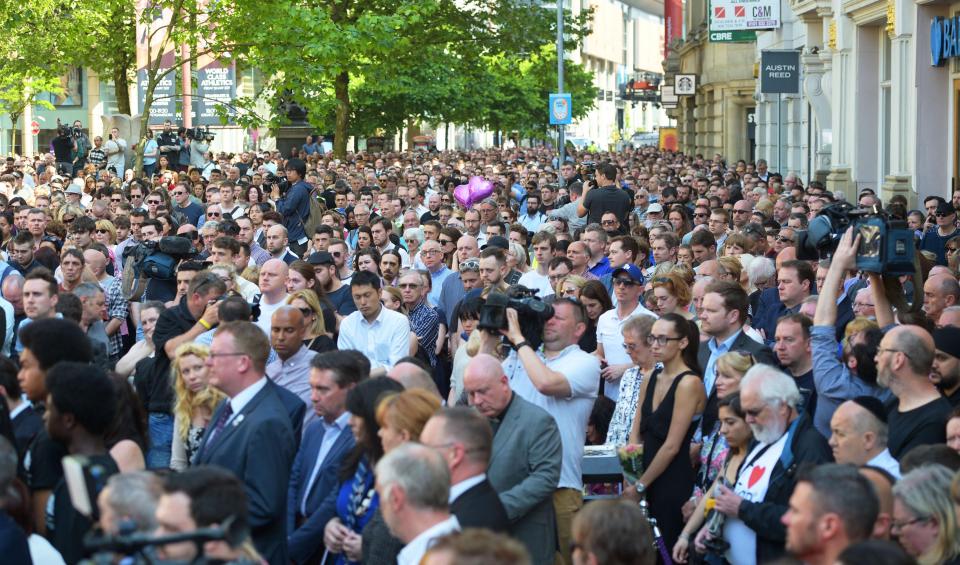  Locals stood side by side to remember the 22 killed and many injured in Monday's atrocity