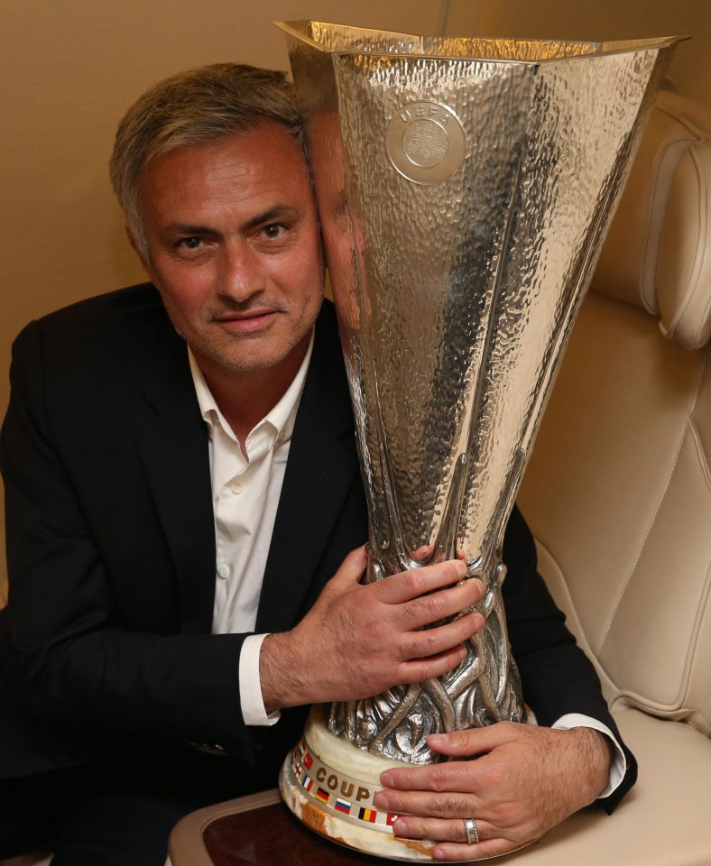  Man United boss Jose Mourinho cuddles the Europa League trophy