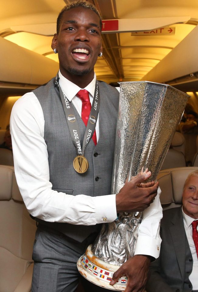  Paul Pogba, medal around his neck, is overjoyed at with his Europa League triumph