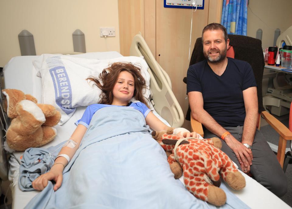  Evie, who is being treated for leg wounds, is pictured with her dad Craig