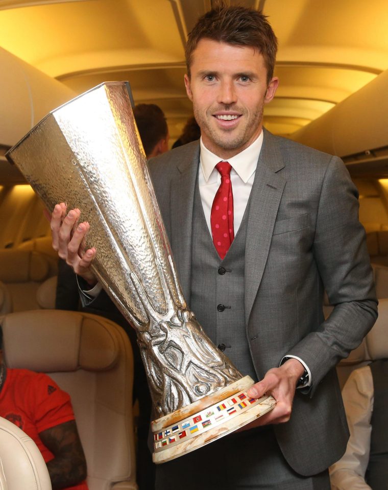  Michael Carrick, who is out of contract, holds the Europa League trophy