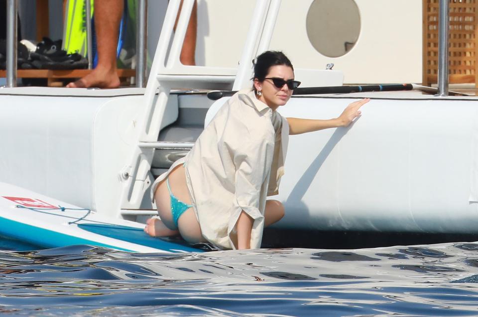  She clings on to the side of the boat