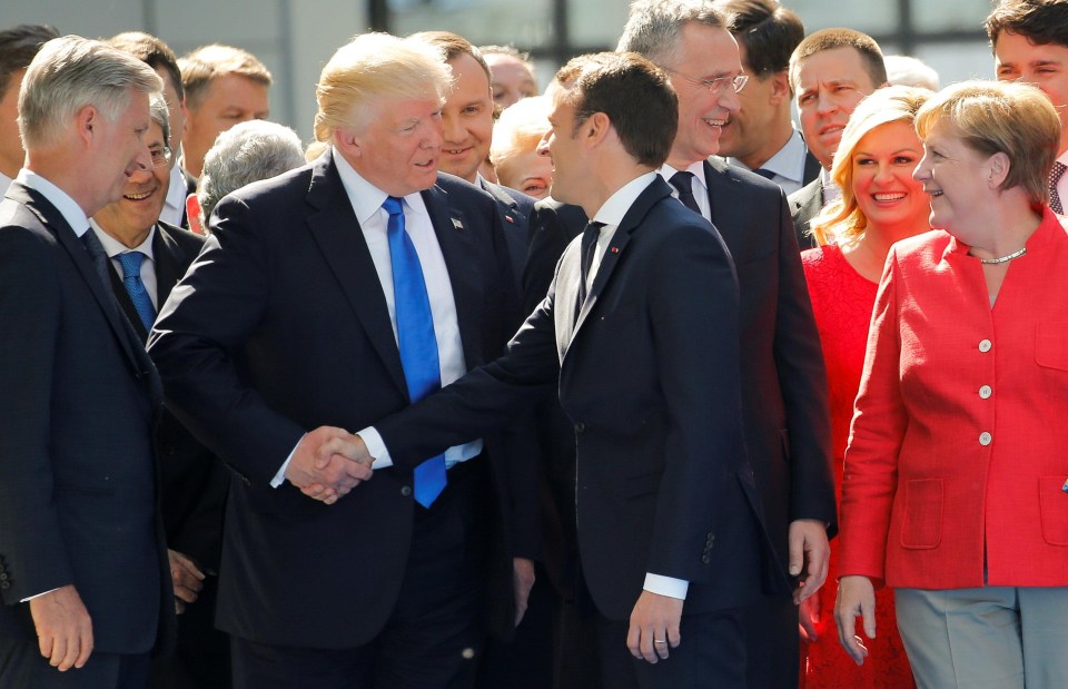 Trum uses his unusual handshake technique on French leader Emmanuel Macron