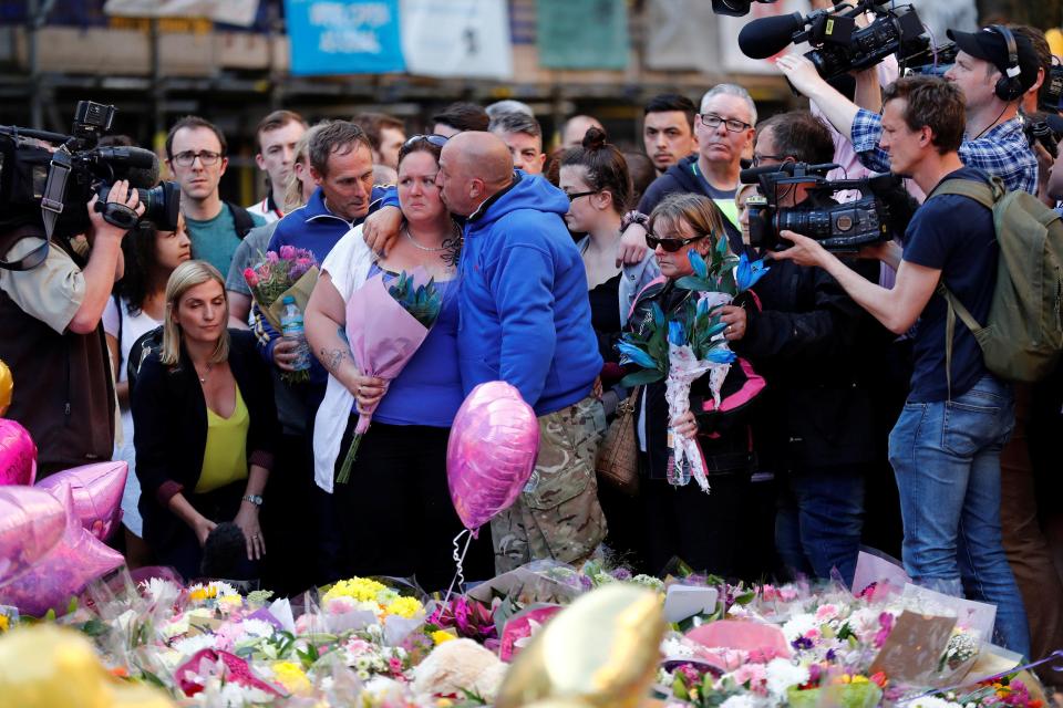  The pair consoled each other as they visited the square which is overflowing with floral tributes to the victims