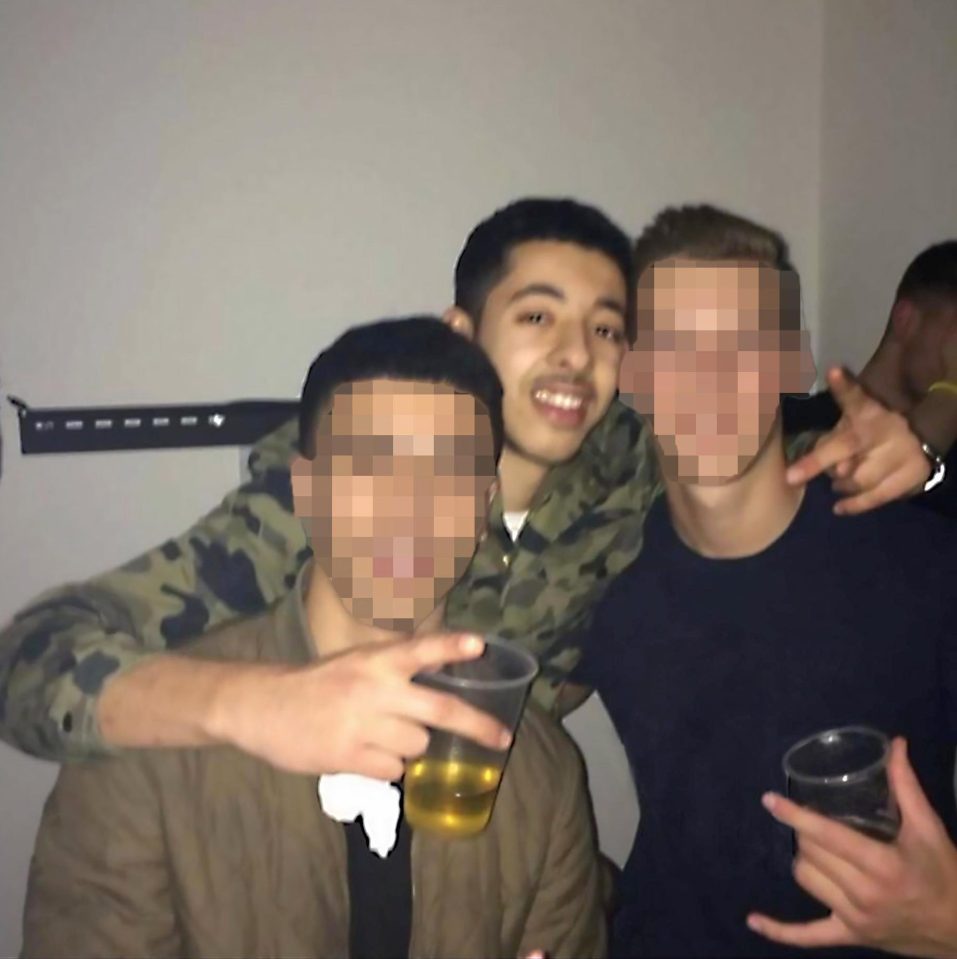  Grinning killer . . . Salman Abedi with vodka Red Bull with pals at a party