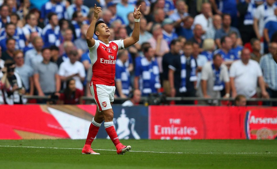  Alexis Sanchez points to the heavens after his opening goal