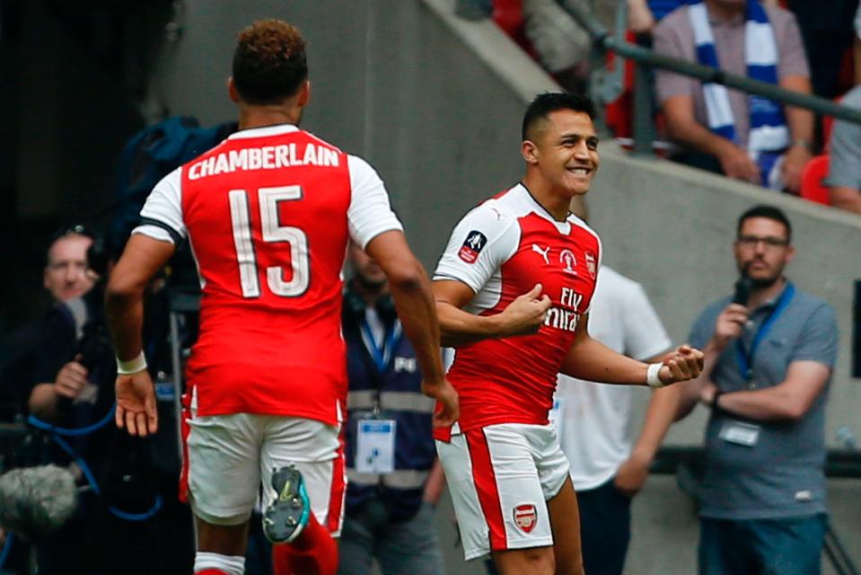  Alexis Sanchez celebrates after scoring the opening goal against Chelsea yesterday