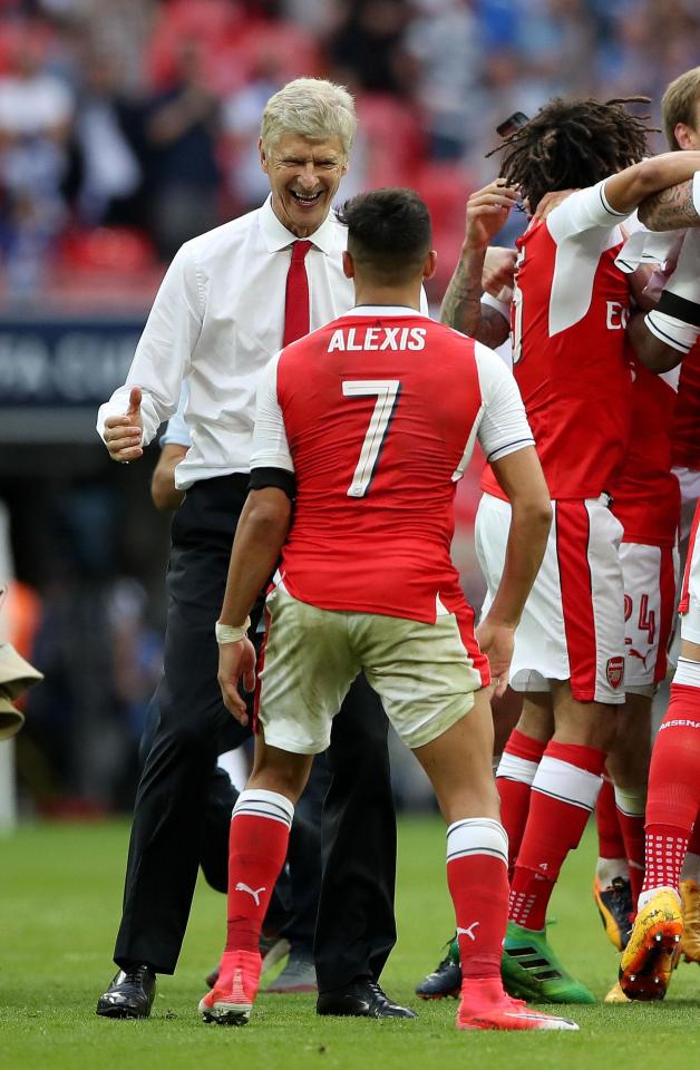  Arsenal goalscorer Alexis Sanchez celebrates with boss Arsene Wenger