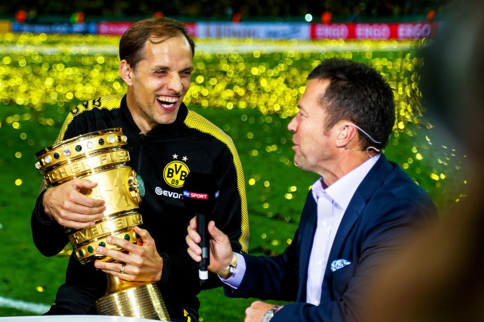  Thomas Tuchel is all smiles as he holds the first trophy of his managerial career