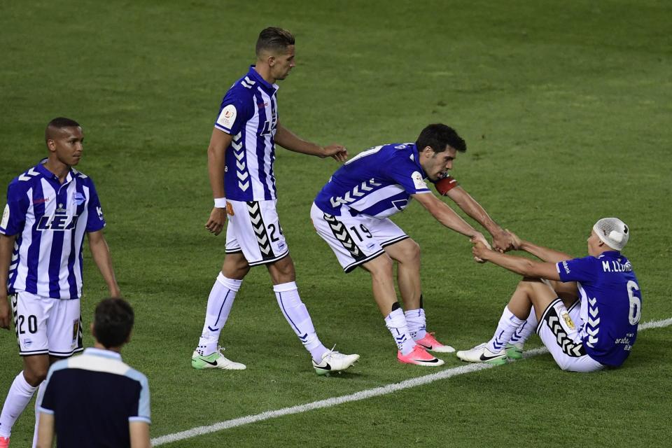  Alaves players console each other as they lose Copa del Rey final to Barcelona