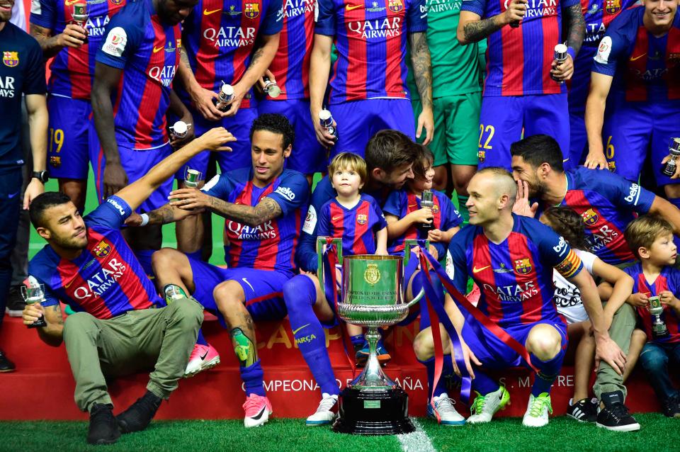  Barcelona captain Andres Iniesta next to the Copa del Rey trophy