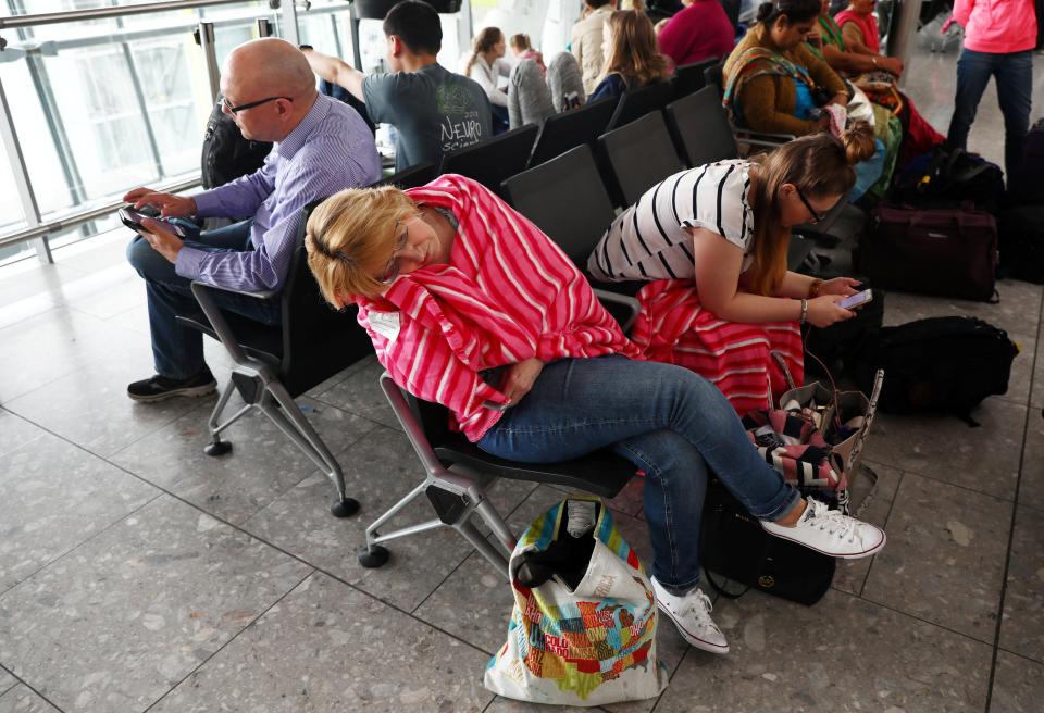  A woman sleeps while sitting on a chair during the chaos