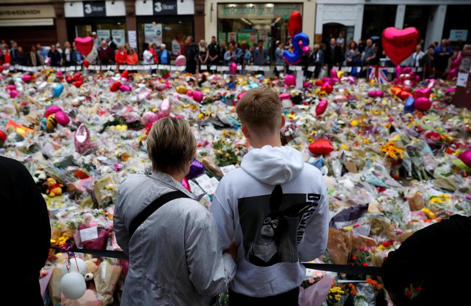  Members of the public take part in a vigil on St. Ann's Square in Manchester, on May 29, 2017, exactly one week after a bomb attack at Manchester Arena killed 22 and injured dozens more