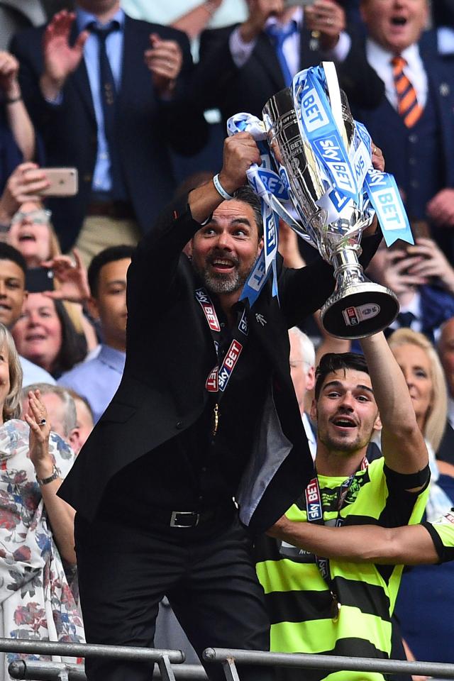  The former Schalke star celebrates with the play-off trophy after beating the Royals on penalties at Wembley