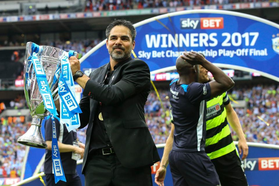  David Wagner holds aloft the play-off trophy after Huddersfield Town beat Reading in the final at Wembley