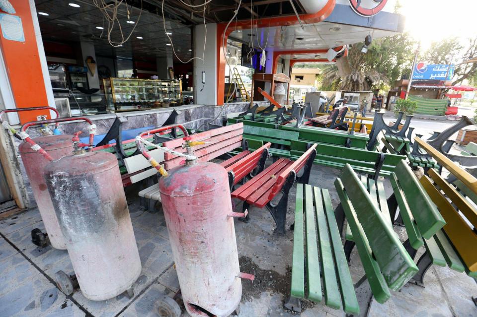  The ISIS car bomb detonated out this ice cream parlour last night, killing 13 people and injuring 30