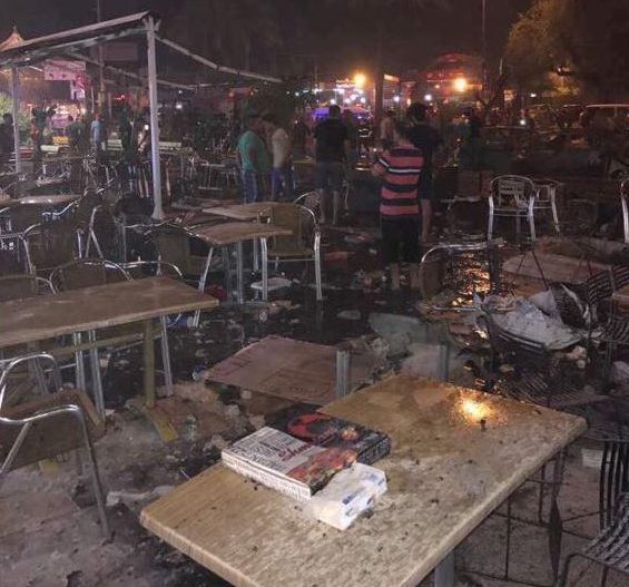  Tables and chairs lie scattered across pools of blood at the ice cream parlour