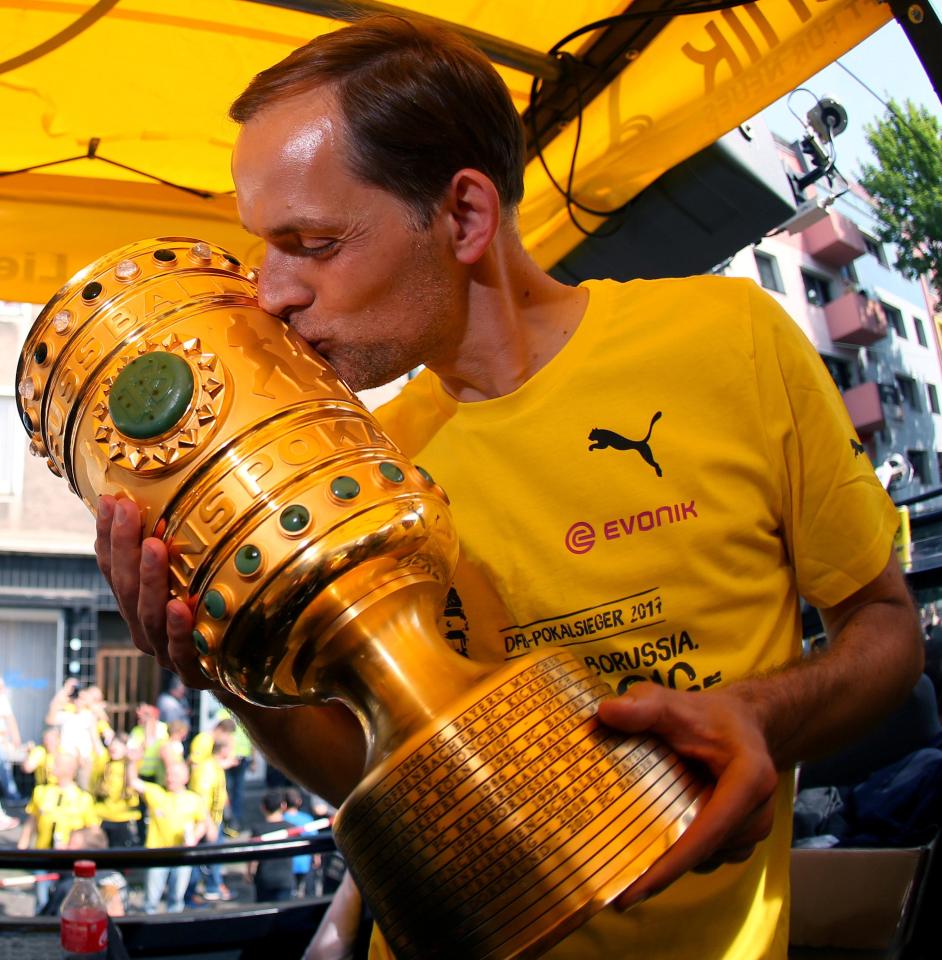  Thomas Tuchel celebrates with the DFB Pokal trophy after Saturday victory