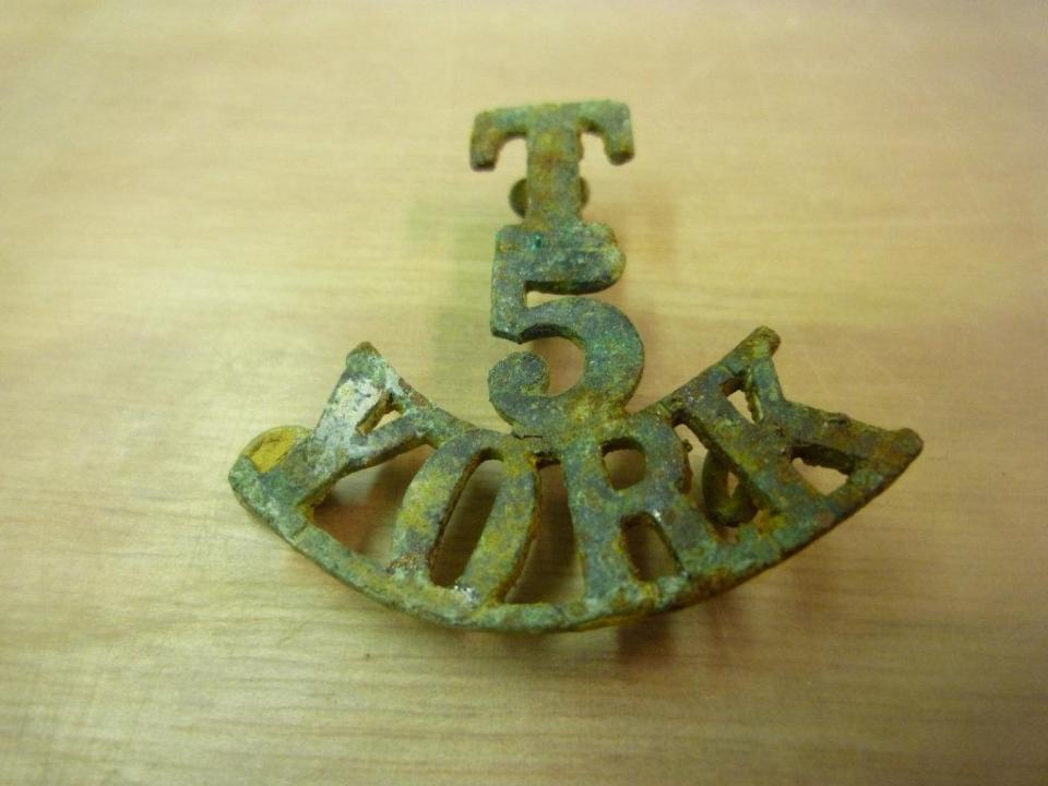  The recovered cap badge belonging to Private Parker