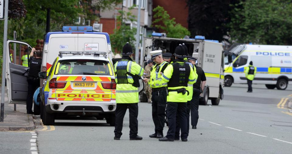  Terror police and bomb disposal units search a property in Wigan