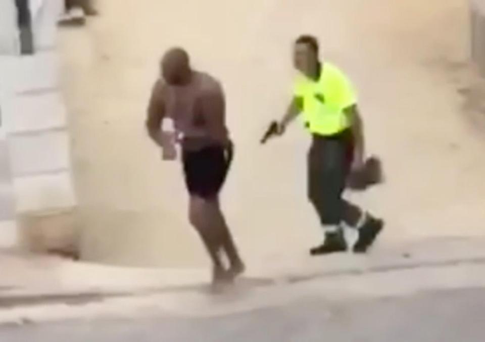  Dramatic footage shows the moment a man Spanish media claims is Marcus Stewart is led away by an armed policeman