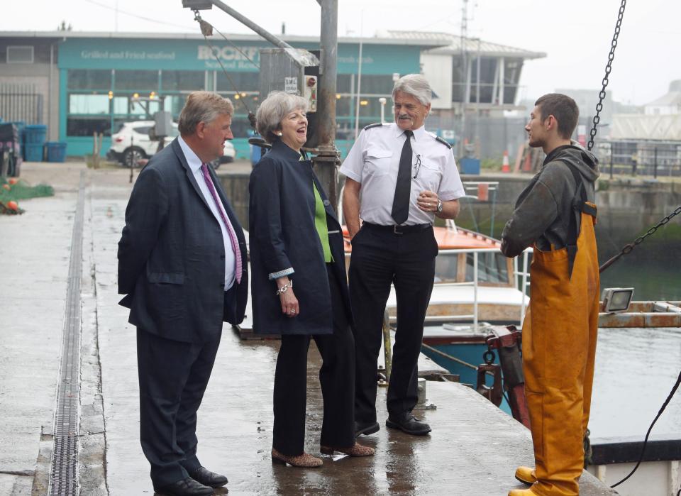  Earlier Mrs May talked to fishermen at the Plymouth docks