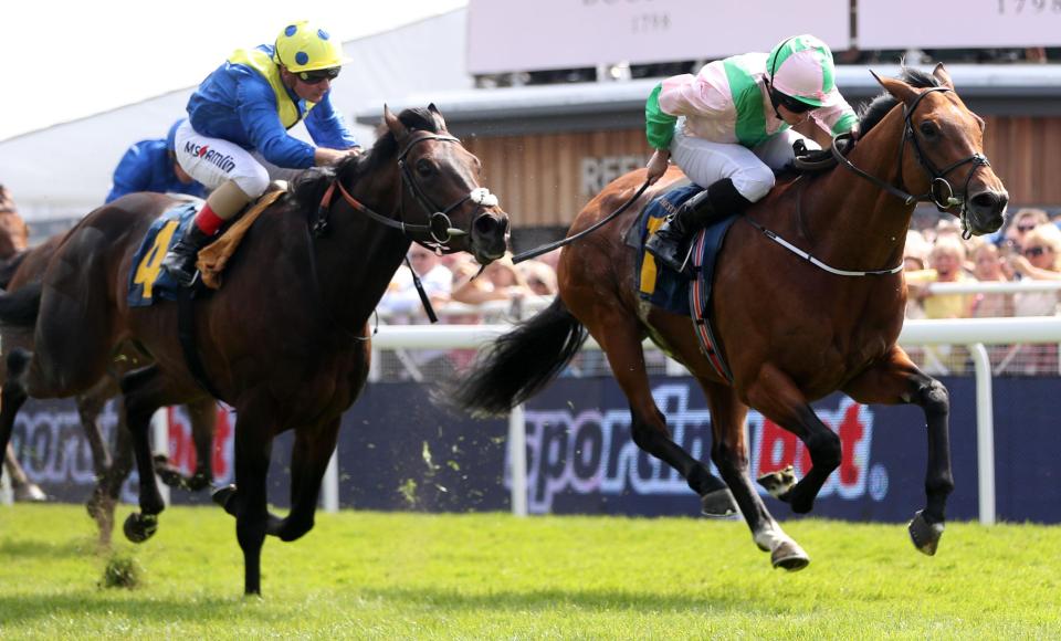  Deauville (right) holds off the late challenge of Poet's Word at Chester