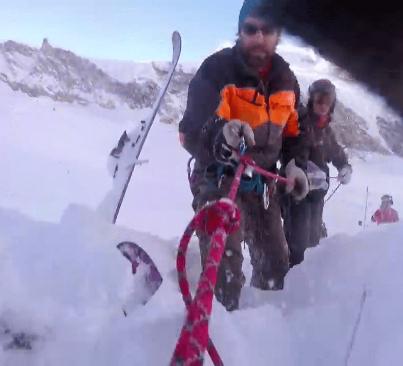 Rescuers from the alpine rescue team Air Zermatt pull Jamie from the crevasse after answering his call