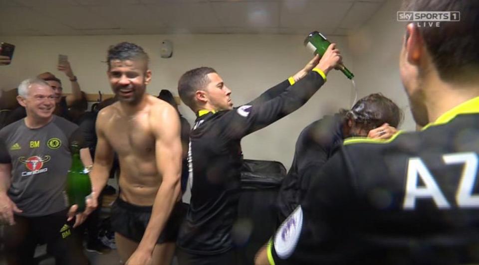  Antonio Conte is soaked by Eden Hazard in the dressing room