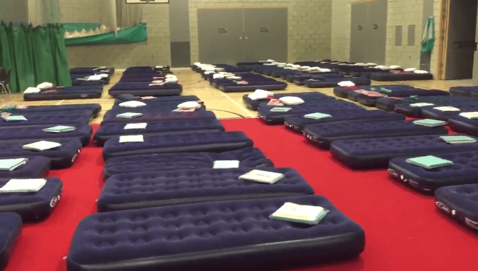 A resident has posted footage of the inside of Swiss Cottage Leisure Hall where families spent the night